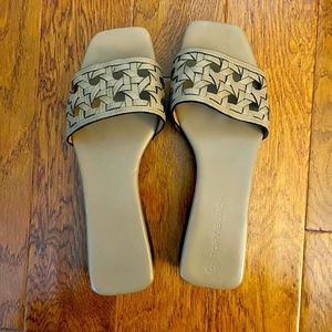 Basket-Weave Clog. Hand-woven leather and a wooden sole. Foam padding on footbed